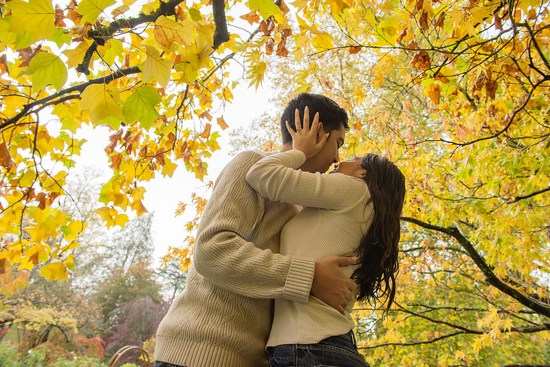 Couple looking at each other on their engagement day at the Botanical Gardens in Bath