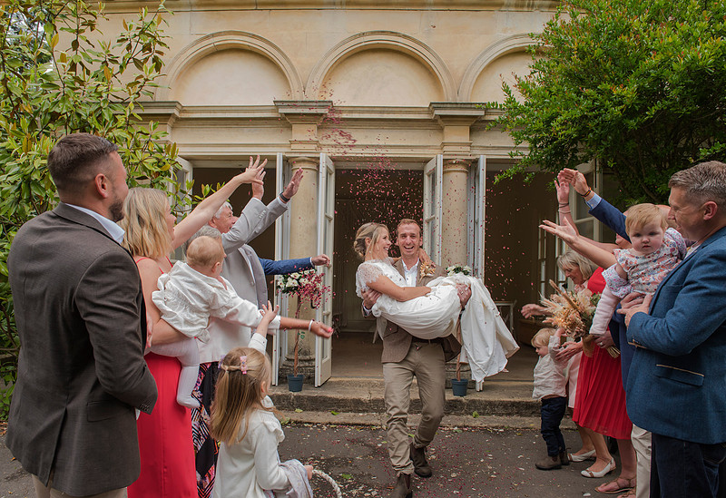Couple on their wedding day at Temple of Minerva. Wedding photos. Confetti shot. Romantic wedding. Beata Cosgrove Photography