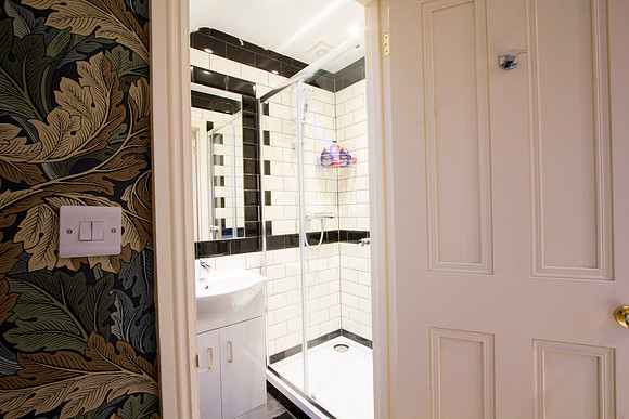 Upstairs bathroom with town facing room