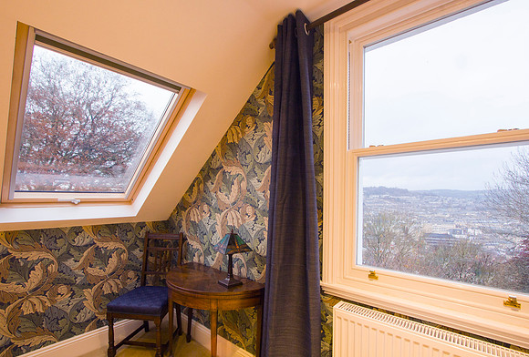 Bedroom 1 with ensuite bathroom and town view