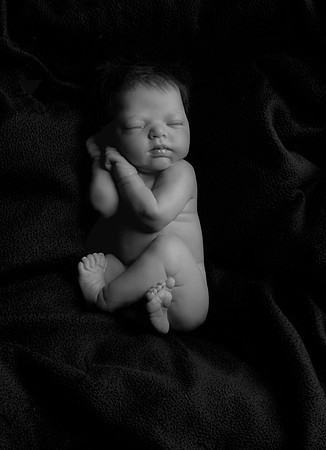 Sleeping baby on black background