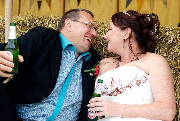 wedding scene - bridge and groom drinking and laughing